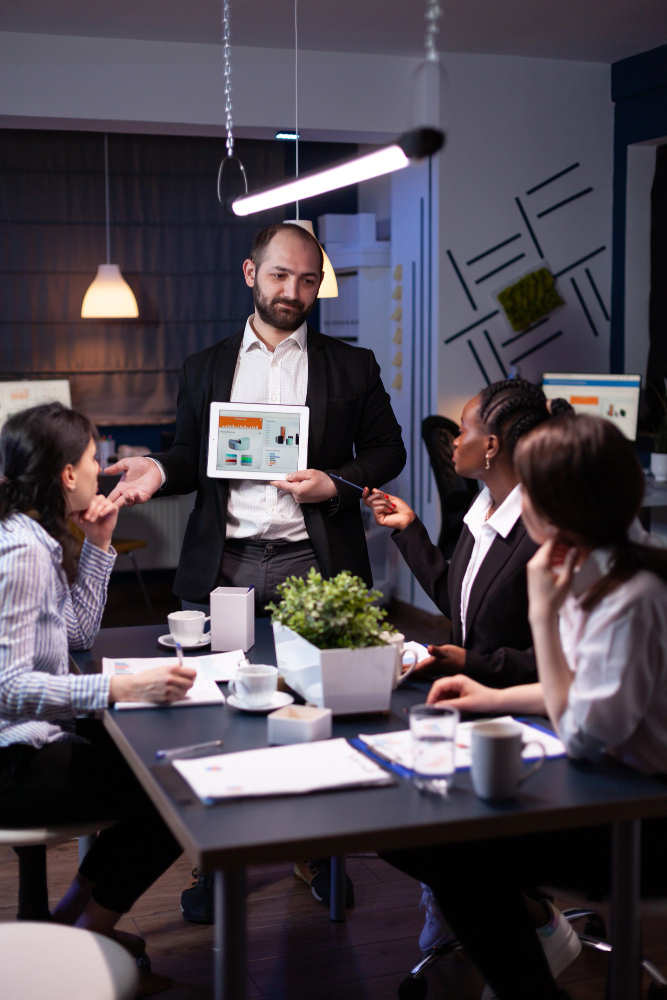 //www.darshrecruitment.com/wp-content/uploads/2024/01/business-entrepreneur-man-presenting-company-statistics-using-tablet-financial-presentation.jpg